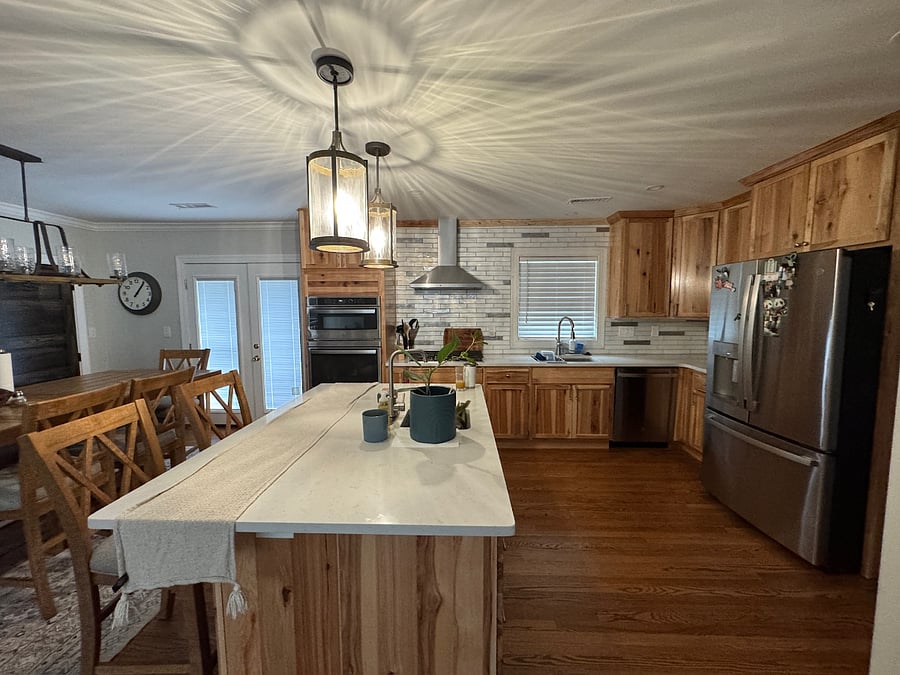 Fully equipped kitchen with rustic hickory cabinets and hardwood floors