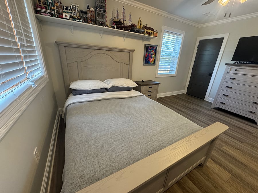 Queen bedroom with large walk-in closet and butler's pantry