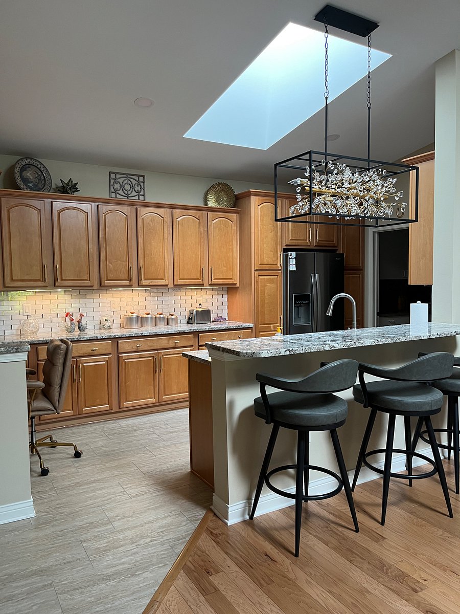 Fully stocked large kitchen with washer and dryer in utility room.