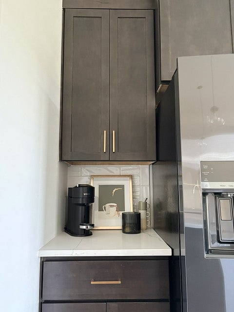 coffee bar with Nespresso machine, coffee pot also provided