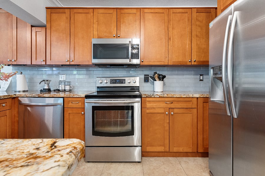 Dishwasher, microwave, stove, and refrigerator.
