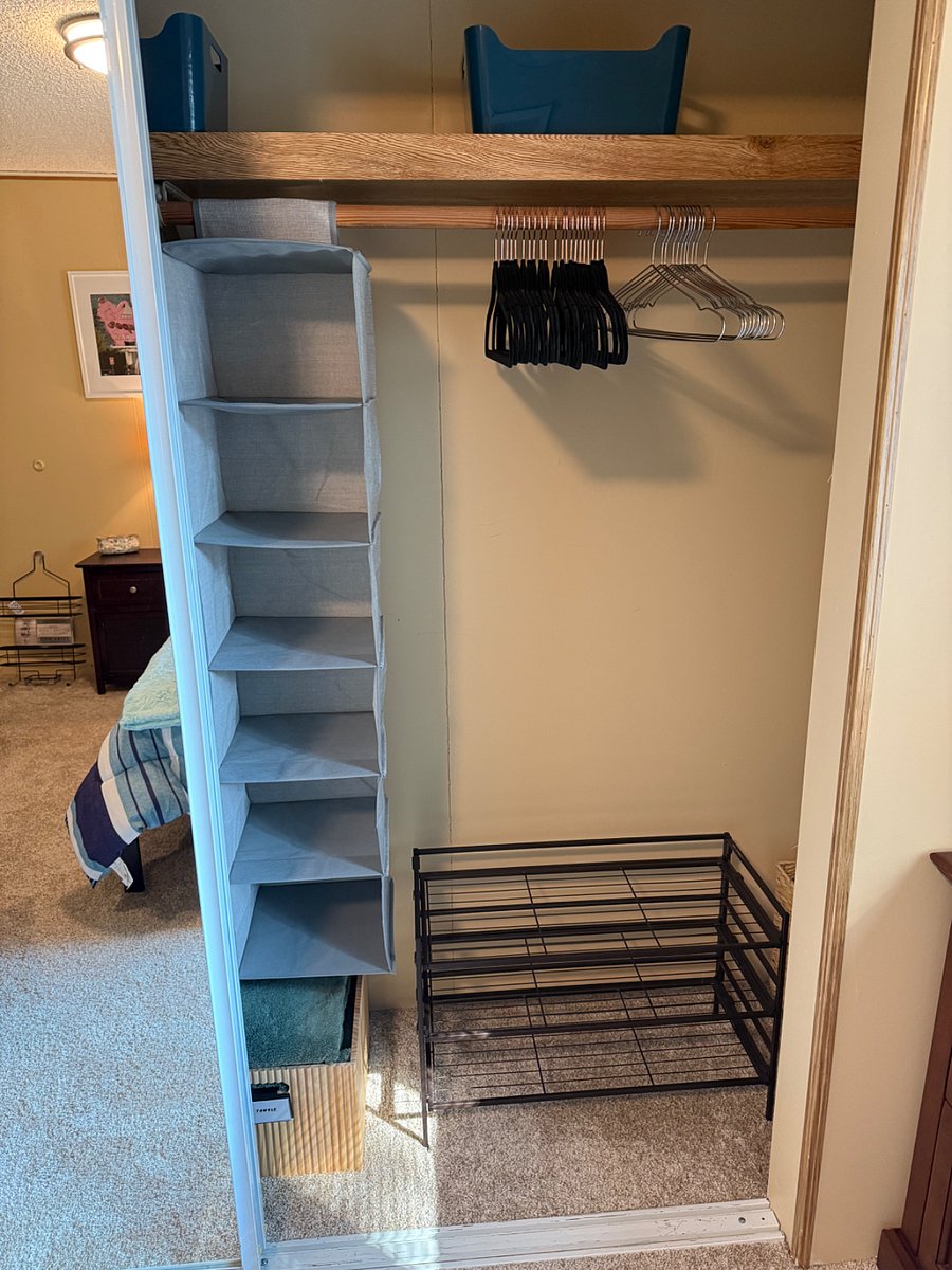 Closet Right Side: hanging soft bins, shoe rack, extra bin for your use, additional comforter and Minky blanket.