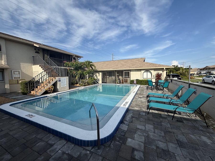 Pool/Courtyard has a table with 4 chairs and 4 sunlounges