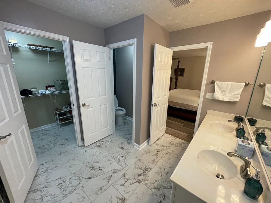 Master Bathroom, closet, and private commode room.