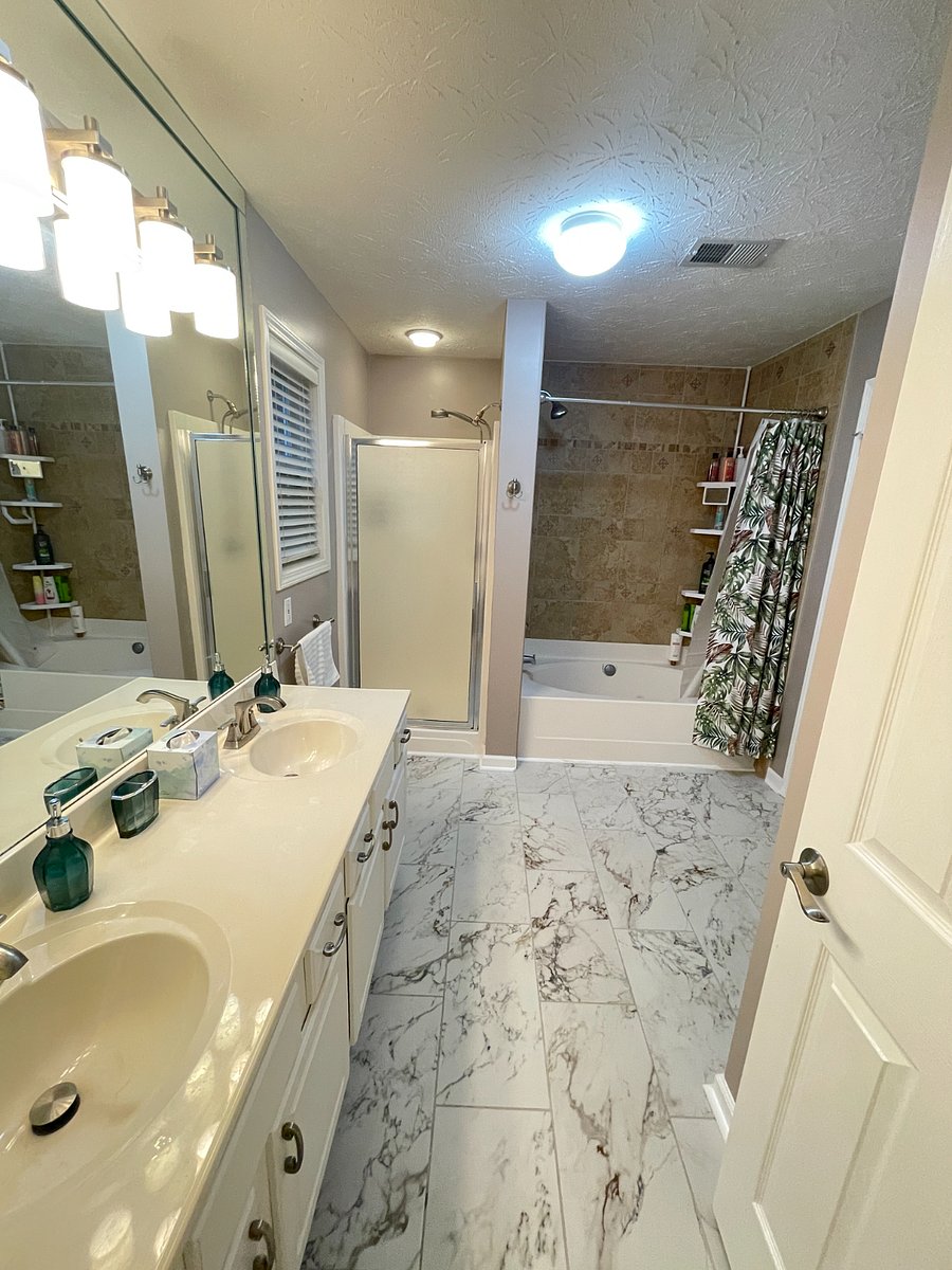 Master Bathroom with 2 showers and a garden tub.