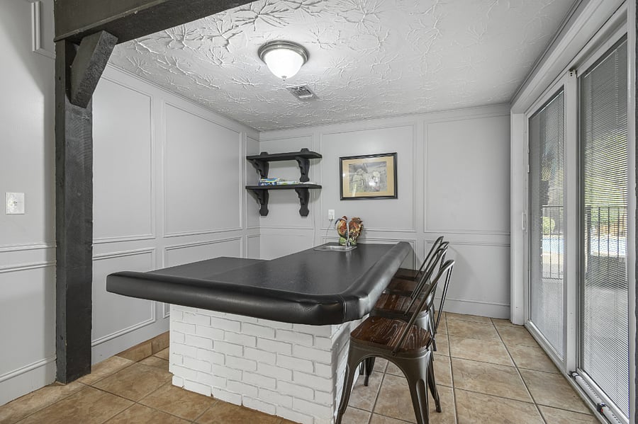 Special game nook for those who enjoy playing cards, dominoes, board games, or homework area. Also, easy to serve those going in and out of the pool.