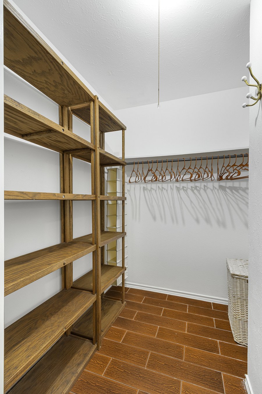 Master bedroom has two walk in closets. This is the larger one.
