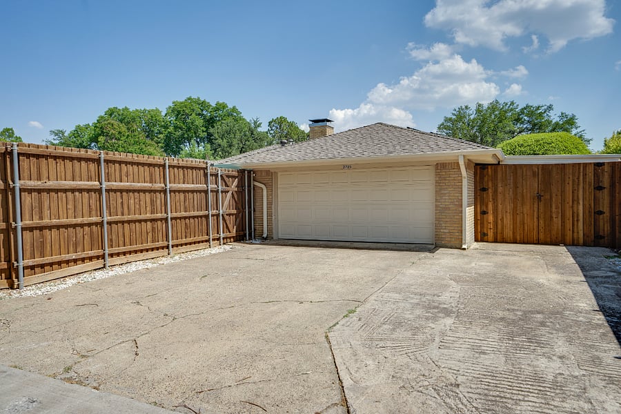 Rear entry, 2 car garage with lots of extra space to park on an oversized driveway. Boat, trailer, large truck, POD, endless options. Also curb parking for one vehicle in front of the house is allowed.