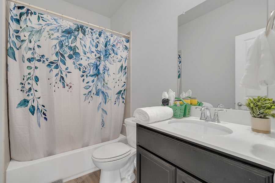 Full bathroom with tub/shower combo located right outside bedroom door.