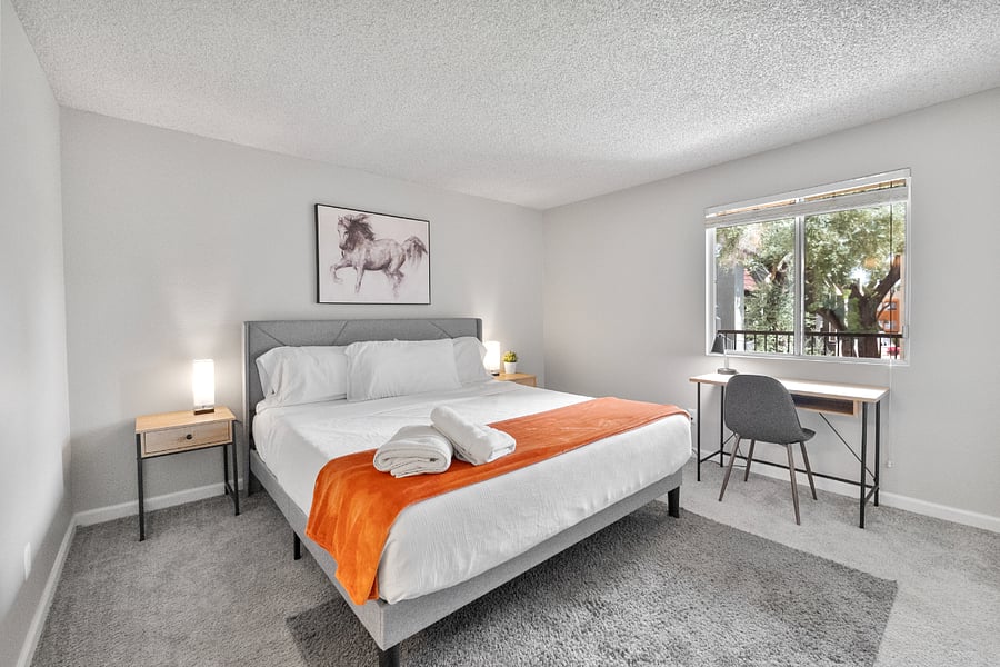 Peaceful bedroom with a plush beding and soft linens.