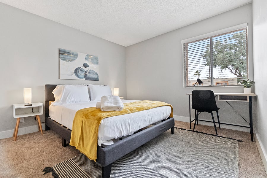 Peaceful bedroom with a plush queen bed and soft linens.
