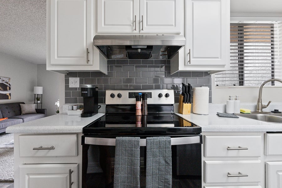 Fully equipped kitchen with stainless steel appliances.