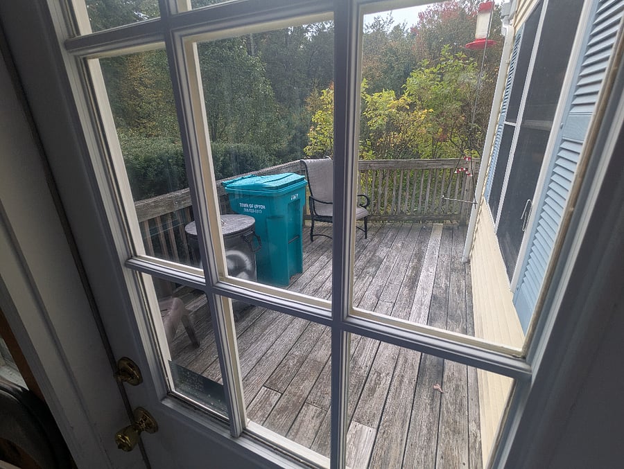 deck trash barrels normally at side of house