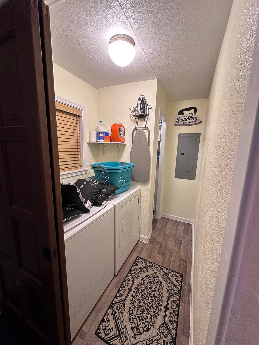 Washer and dryer with ironing board