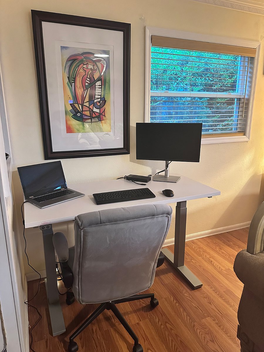 Sitting and Standing desk equip with docking station (laptop not included).