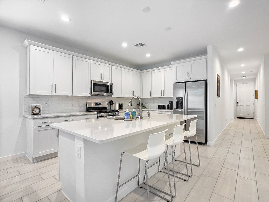 Open kitchen with a spacious island for cooking, sharing meals, and gathering as a family. Includes refrigerator, high bar chairs, toaster, and coffee maker.
Kitchen features a reverse osmosis system for clean, great-tasting drinking water.