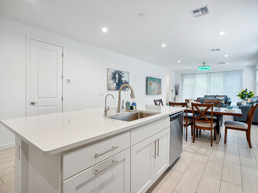 Open kitchen with a spacious island for cooking, sharing meals, and gathering as a family. Includes refrigerator, high bar chairs, toaster, and coffee maker.
Kitchen features a reverse osmosis system for clean, great-tasting drinking water.