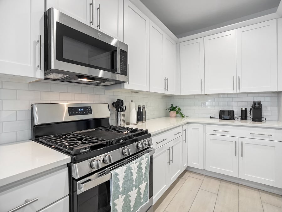Open kitchen with a spacious island for cooking, sharing meals, and gathering as a family. Includes refrigerator, high bar chairs, toaster, and coffee maker.
Kitchen features a reverse osmosis system for clean, great-tasting drinking water.