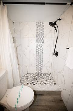 Shared hallway bathroom with shower