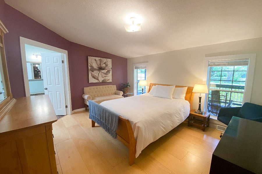 Primary bedroom with access to the primary bathroom. Queen bed.