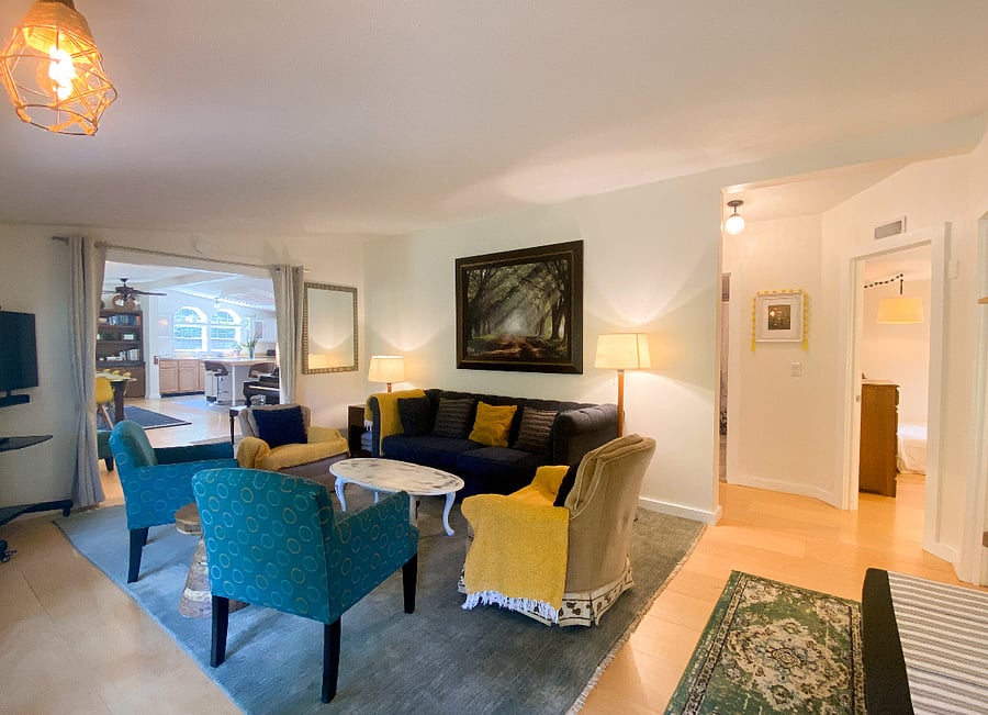 Cozy living room. View from the front entry door. (The layout is currently a bit different and much more spacious feeling, with just as much seating.)