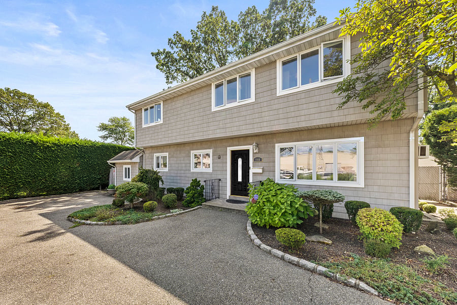 Front of the North Massapequa property and driveway. This apartment includes two off-street parking spaces.