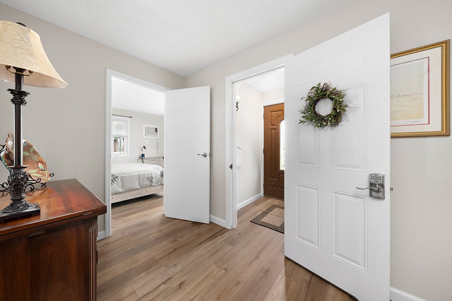 Private keypad-locked apartment door off the shared entrance vestibule. The entry area includes a Large closet for coats and luggage.