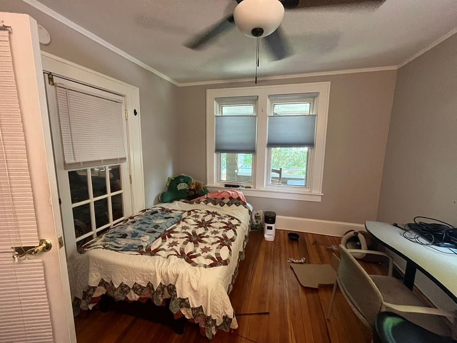 Futon added to room as couch.