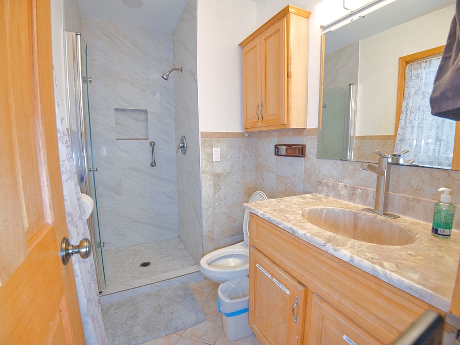 Our private full bathroom is clean, spacious, and stocked with essentials for your convenience. Featuring a shower, fresh towels, and toiletries.