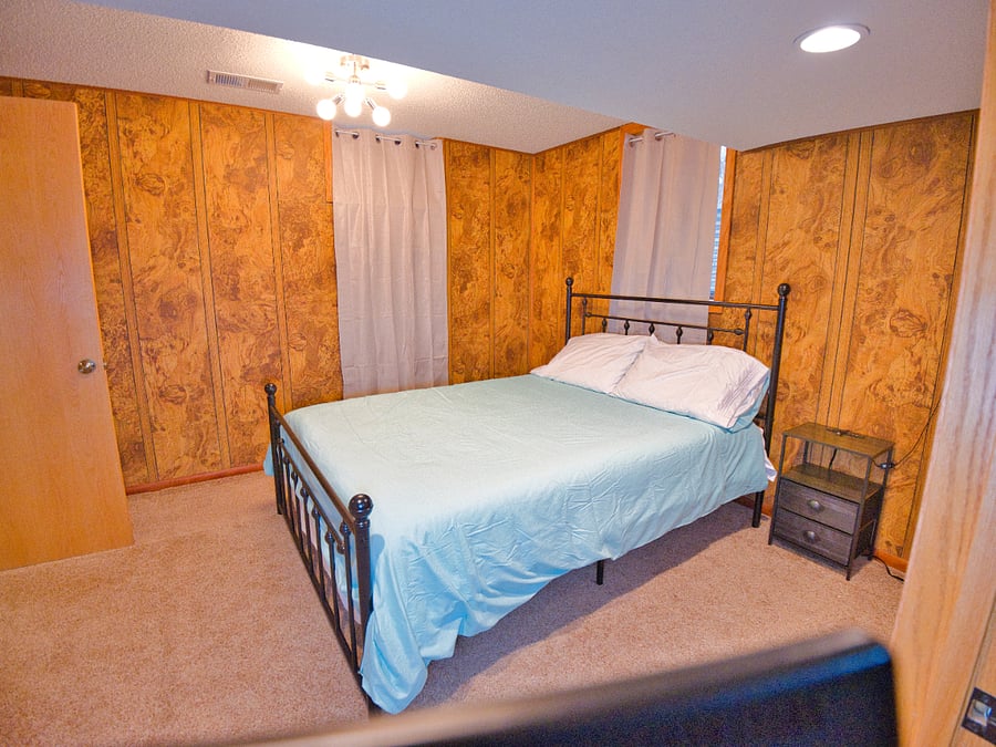 Welcome to your perfect getaway! This charming bedroom offers a cozy queen bed, plush linens, warm decor, and plenty of natural light. Perfect for work or leisure, it's a serene retreat with all the essentials for a restful stay.