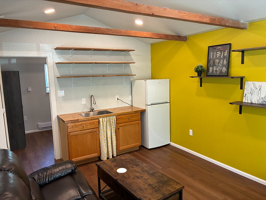Note: Kitchenette is not plumbed. The faucet has a water tank and empties into a local holding tank under the sink.