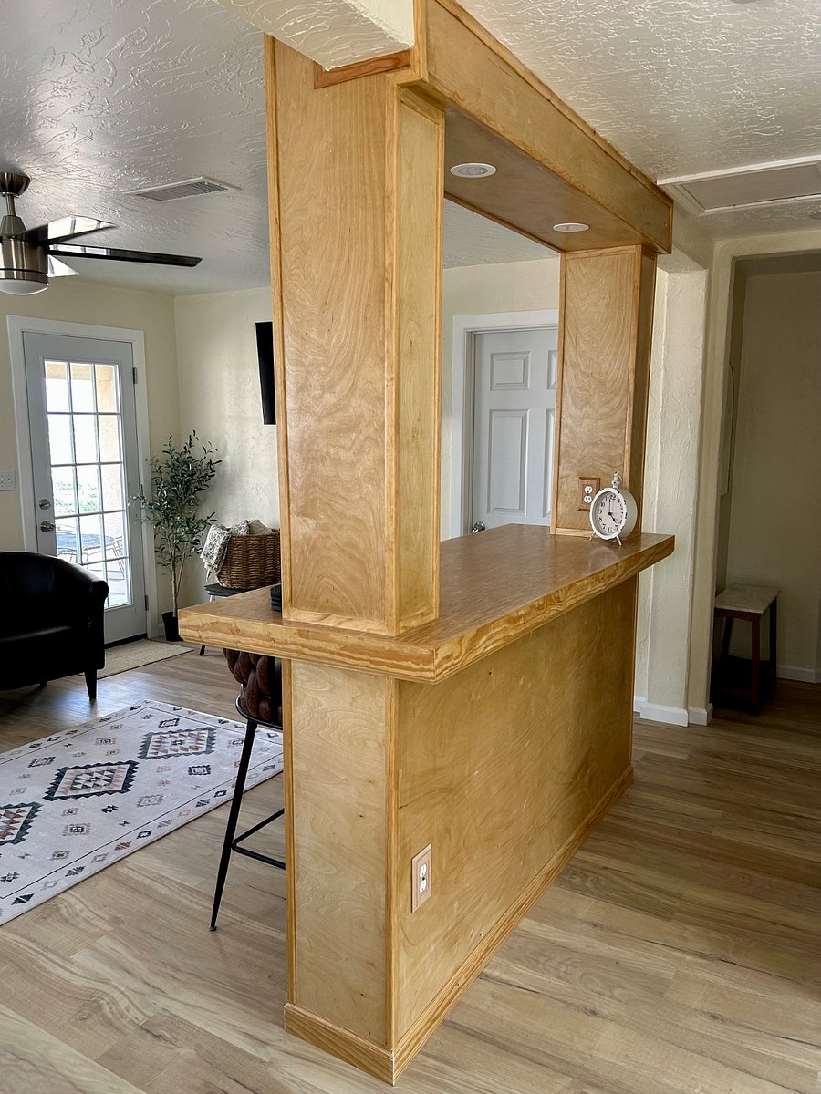 view of counter top bar and hallway
visible door leads to outdoor patio