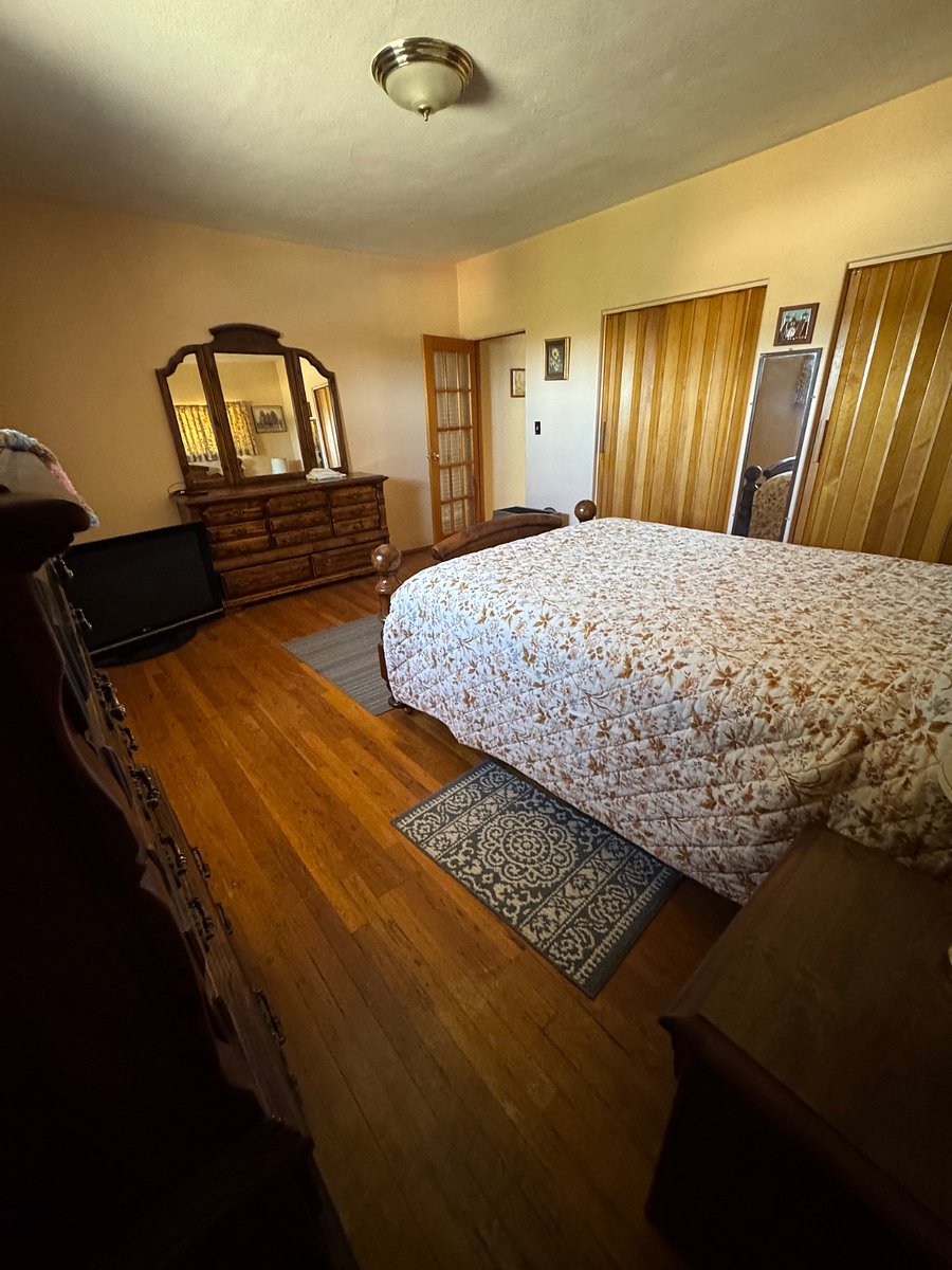 Primary bedroom, queen size bed, dresser and chest of drawers, bedding included
