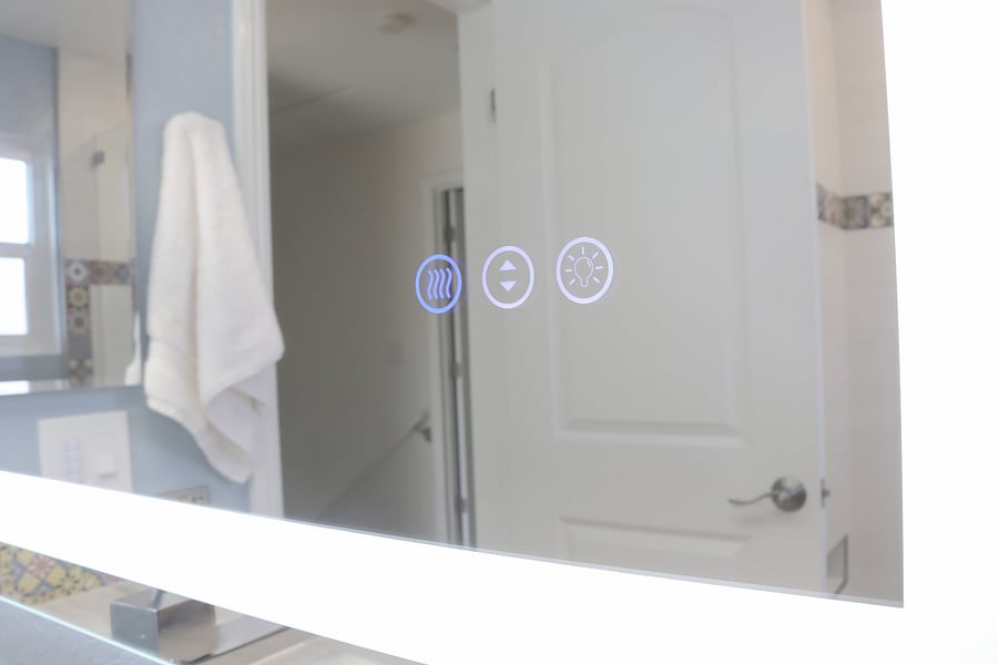 Lighted mirror with defogger