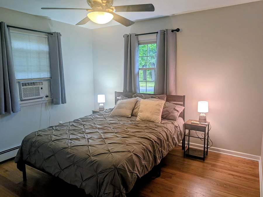 bedroom 1 with queen bed and in closet bureau