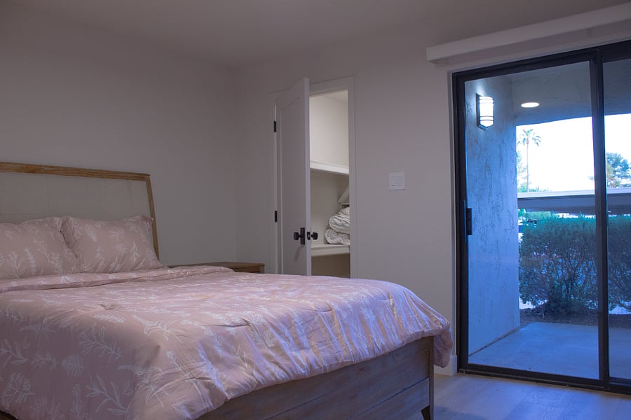 Lighted walk-in closet and access to front patio for cool evenings.