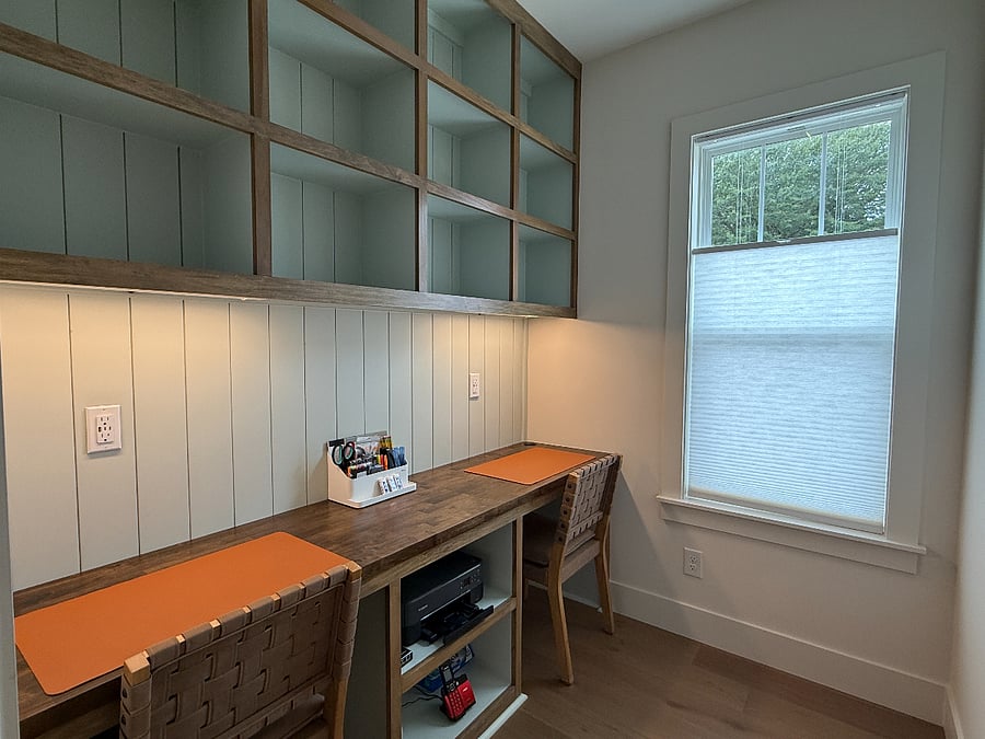 Office space equipped with printer, wall-mounted planning board and supplies