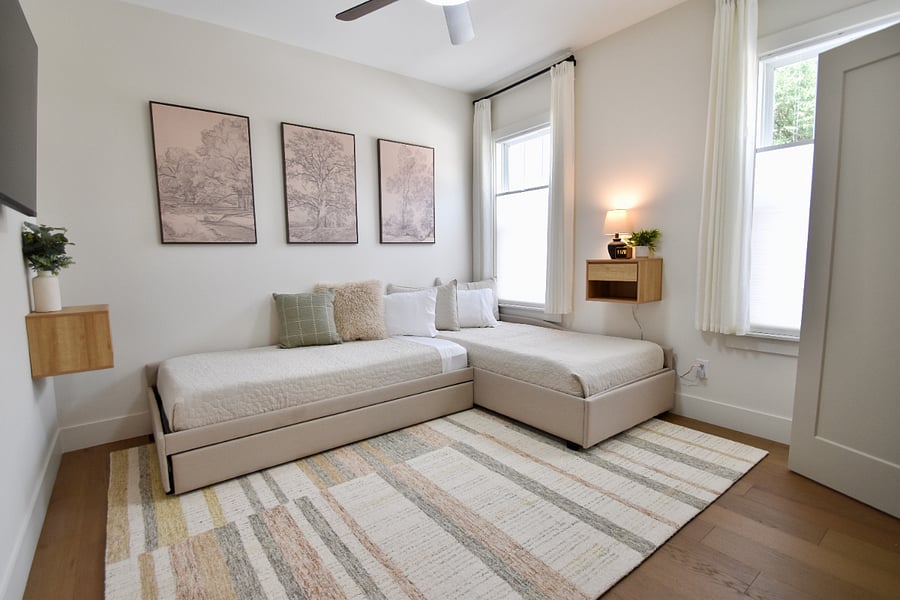 Bedroom sleeps three with trundle bed with closet system complete with drawers and shoe rack