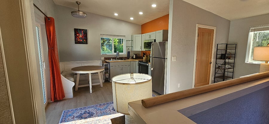 Kitchen has a cozy built-in corner bench with storage underneath