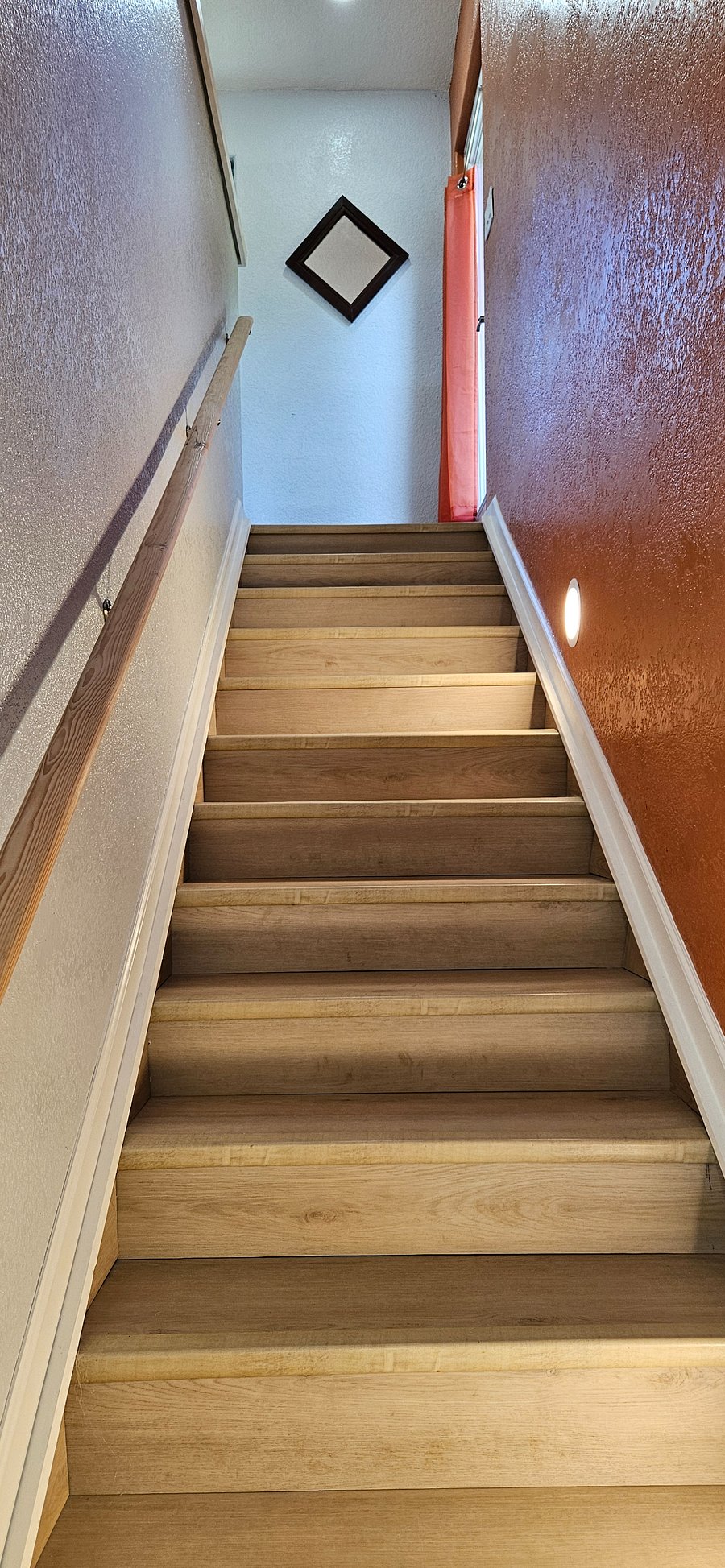 Bedrooms are downstairs, stairs lead up to open plan living room / kitchen