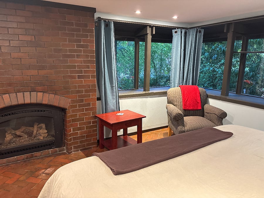 Gas Fireplace with reading chair.  The gas fireplace is your second heat source.  There's also a furnace. 