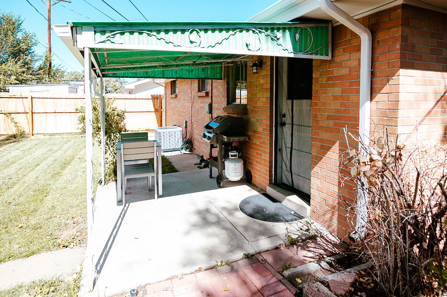 Enclosed backyard with a grill