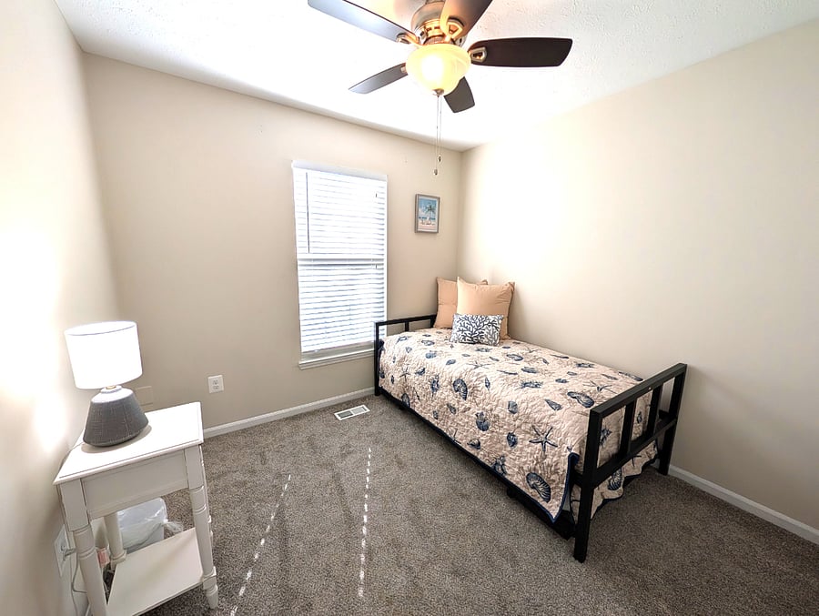 Upstairs twin bedroom steps away from hallway bathroom with twin trundle.