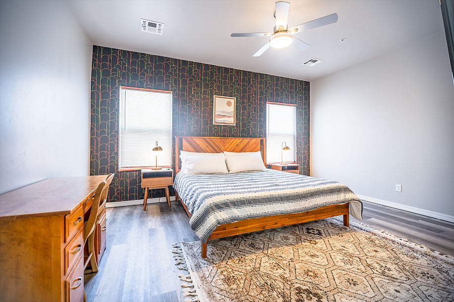 Spacious primary suite with desk for work-from-home, spacious bathroom, shower and walk-in closet