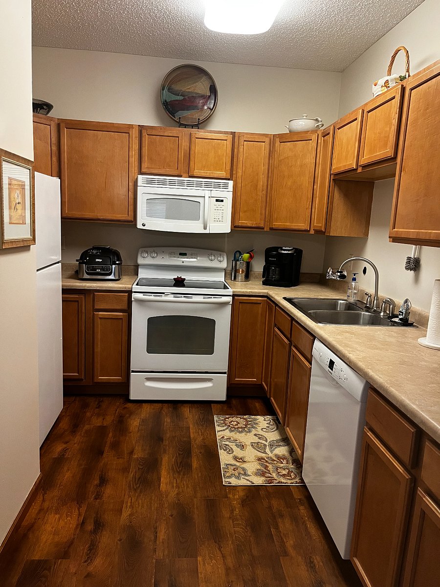 Well-equipped kitchen with Keurig, Ninja airfryer, and more.