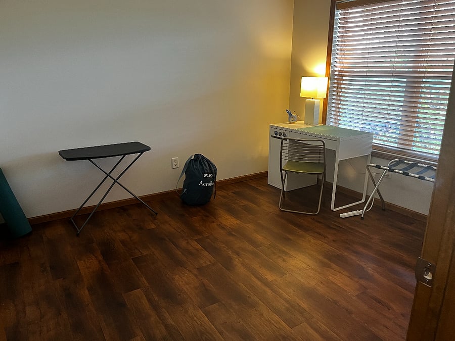 A whole extra room with desk, storage, twin air mattress, and yoga mat!
