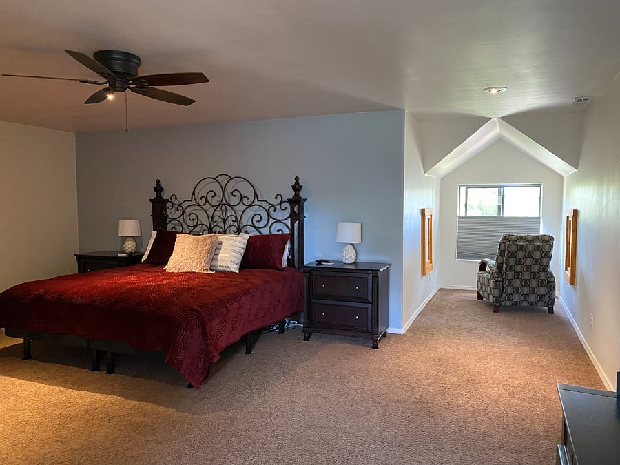 The spacious Master Bedroom features a split-king adjustable bed, a large walk-in closet, a TV (with soundbar)The spacious Master Bedroom features a large walk-in closet, a TV, an reading nook and a vanity. A portable AC unity is available in the summer months.