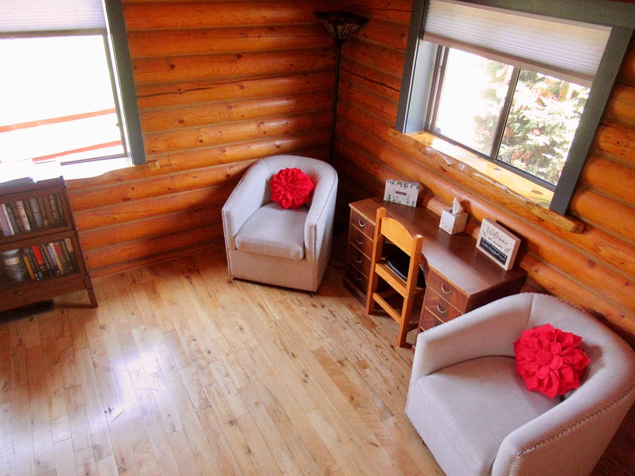 A view of the desk in the living room from the stairs
