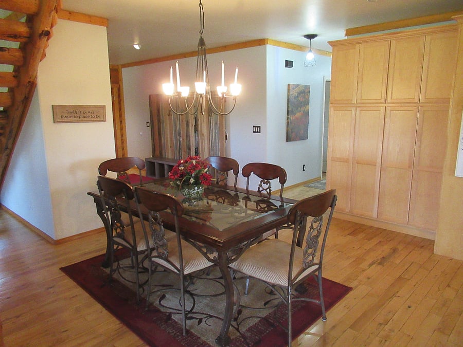 Dining area between living room and kitchen, seats at least 6 people.