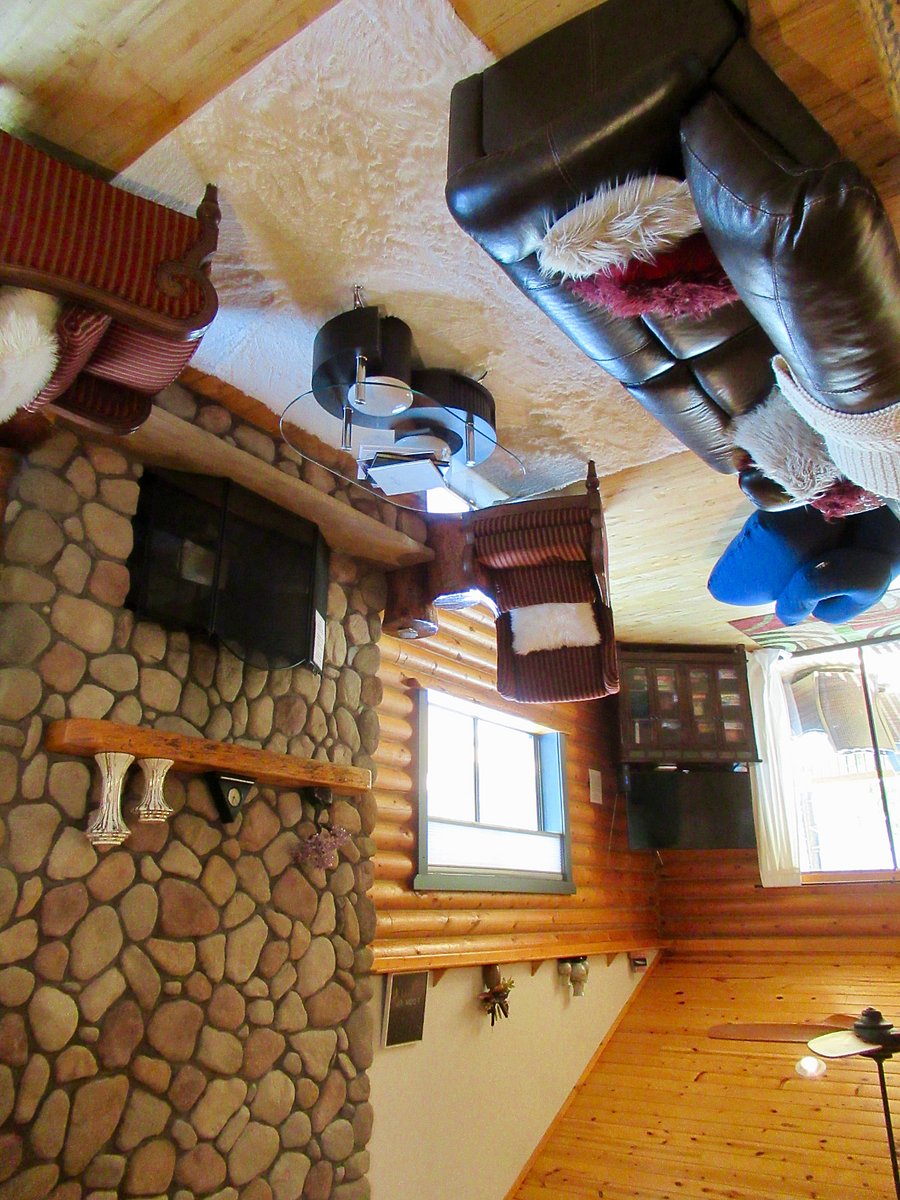 A view of the fireplace in the living room from the stairs.